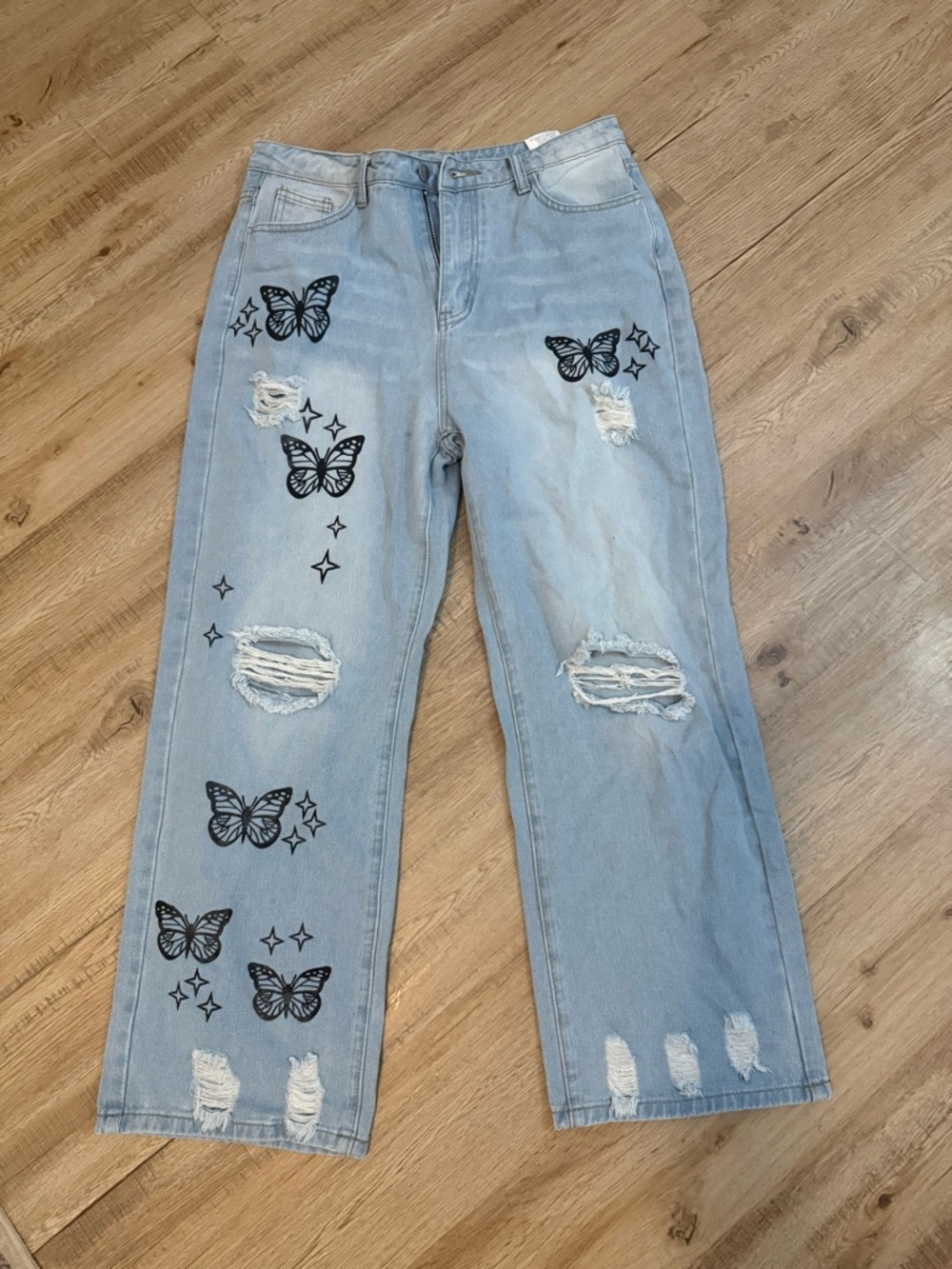 Light Blue Boot-Cut Jeans with Black Butterfly Print